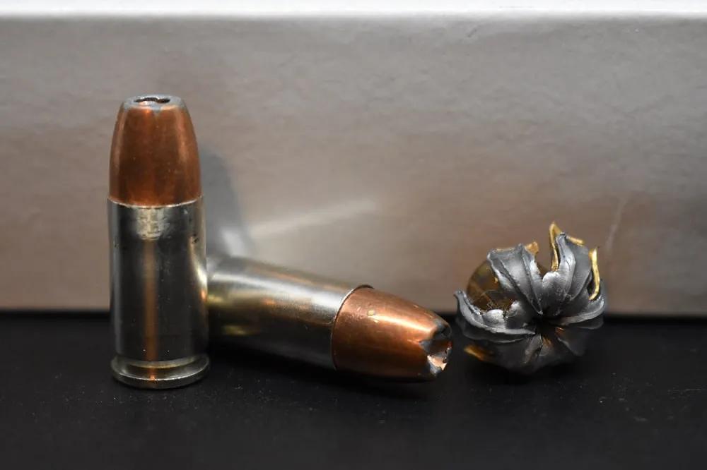 9mm hollow point self defense ammo pre and post fire. Note the mushroom. That hurts.