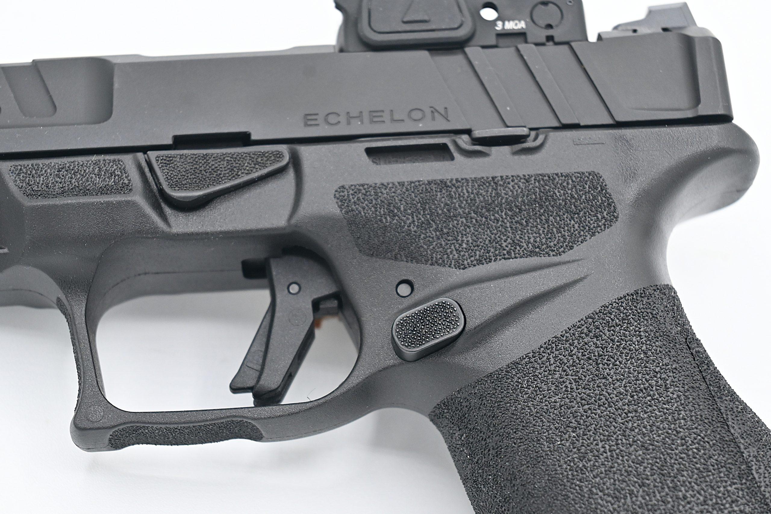 The subtle ears flanking the rear slide release give a positive index point for racking under stress — a detail borrowed from the HK VP9's playbook.
