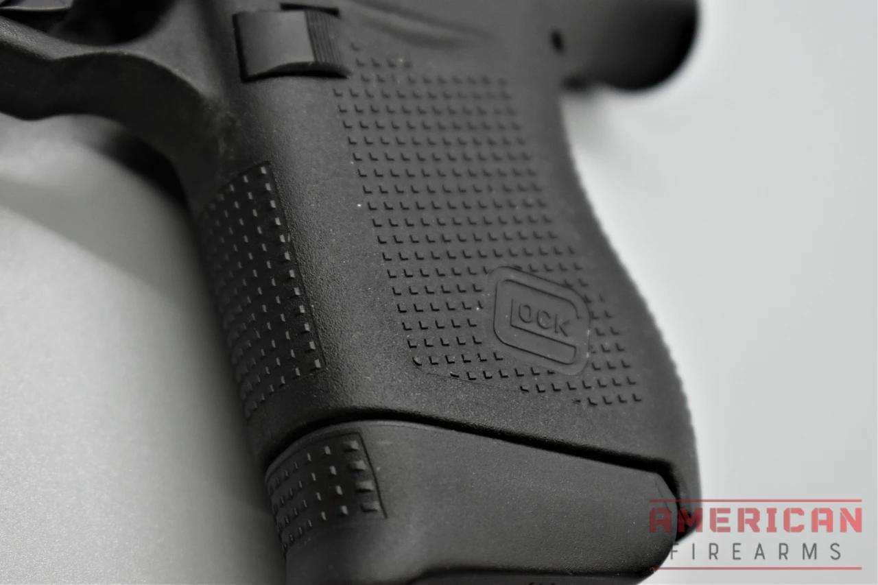 The G43 uses Glock's standard 360-degree RTF grip texture, and the pistol is pretty short -- such that I often have two fingers hanging when firing.