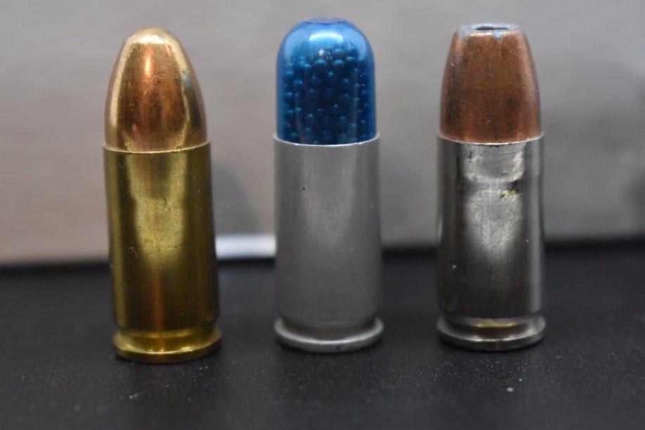 From left to right, brass, steel, and aluminum-cased ammunition.