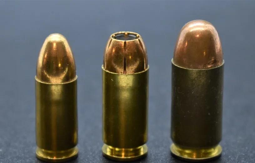 Hollow point personal defense round (center) compared to a full metal jacket. Training rounds will generally be FMJ because they're cheaper and will run consistently in most pistols.