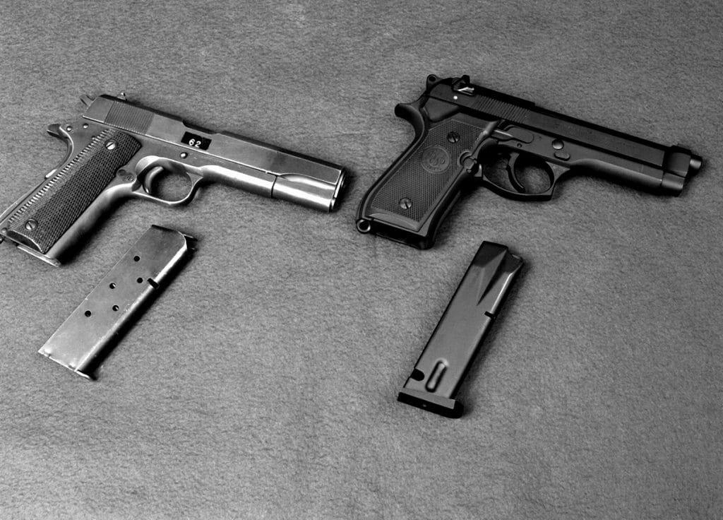 A right side view of the M-1911 .45-caliber pistol, left, and its successor, the M-9 9mm pistol manufactured by Beretta.  Adoption of the M-9 means that the pistol ammunition requirements of the U.S. military are now compatible with those of the other North Atlantic Treaty Organization (NATO) countries.  The M-9 is more lethal, lighter and safer than the M-1911.