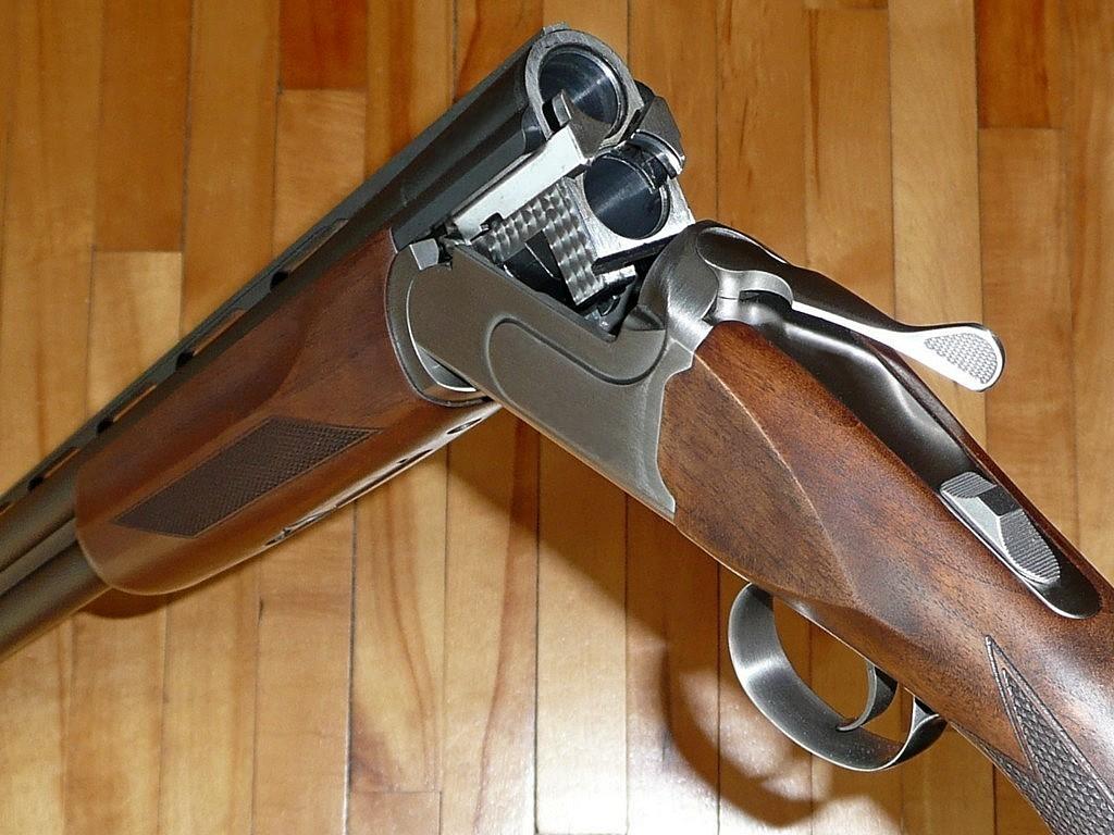 A classic Over/Under shotgun with the open breech.