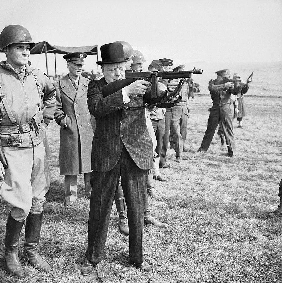Churchill mugging with a Thompson, one of the first carbine-sized PCCs.