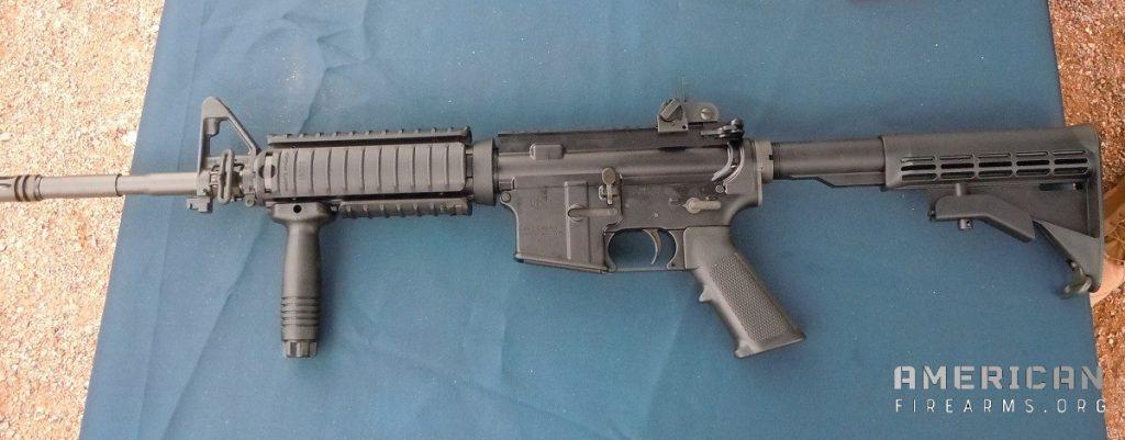 My personal FN M4 rifle, side view. Sling loop, vertical grip, Knights Armament quad-rails? Check, check check.