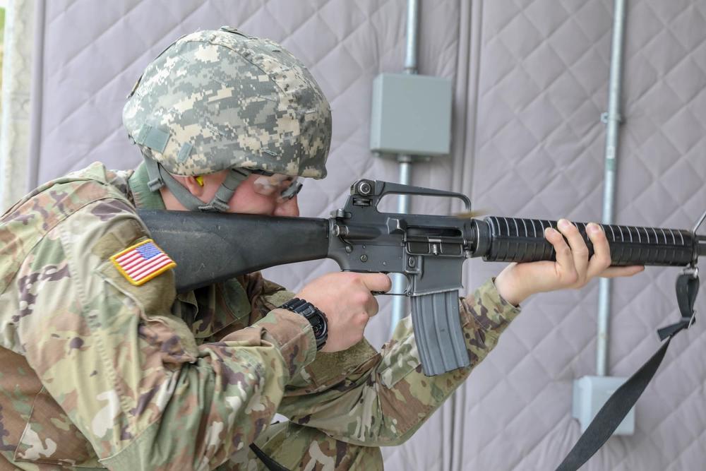 Army Reserve Spc. Andrew Bilgri, a tuba player with the 484th Army Band, fires at a target while qualifying on the M16 rifle at the baffled range at Joiliet Training Area, Illinois, April 24, 2021. His AR is rocking an A2 upper -- you can tell because there's a carry handle and a brass defelector. A1s didn't have the triangluar deflector because southpaws shoot better when dodging brass.  Via DOD