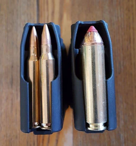 An AR magazine loaded with .223 (left) vs. .450 Bushmaster (left)