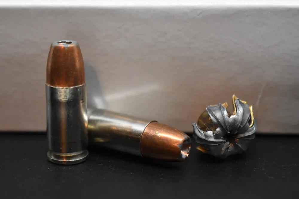 9mm hollow point self defense ammo pre and post fire. Note the mushroom. That hurts.