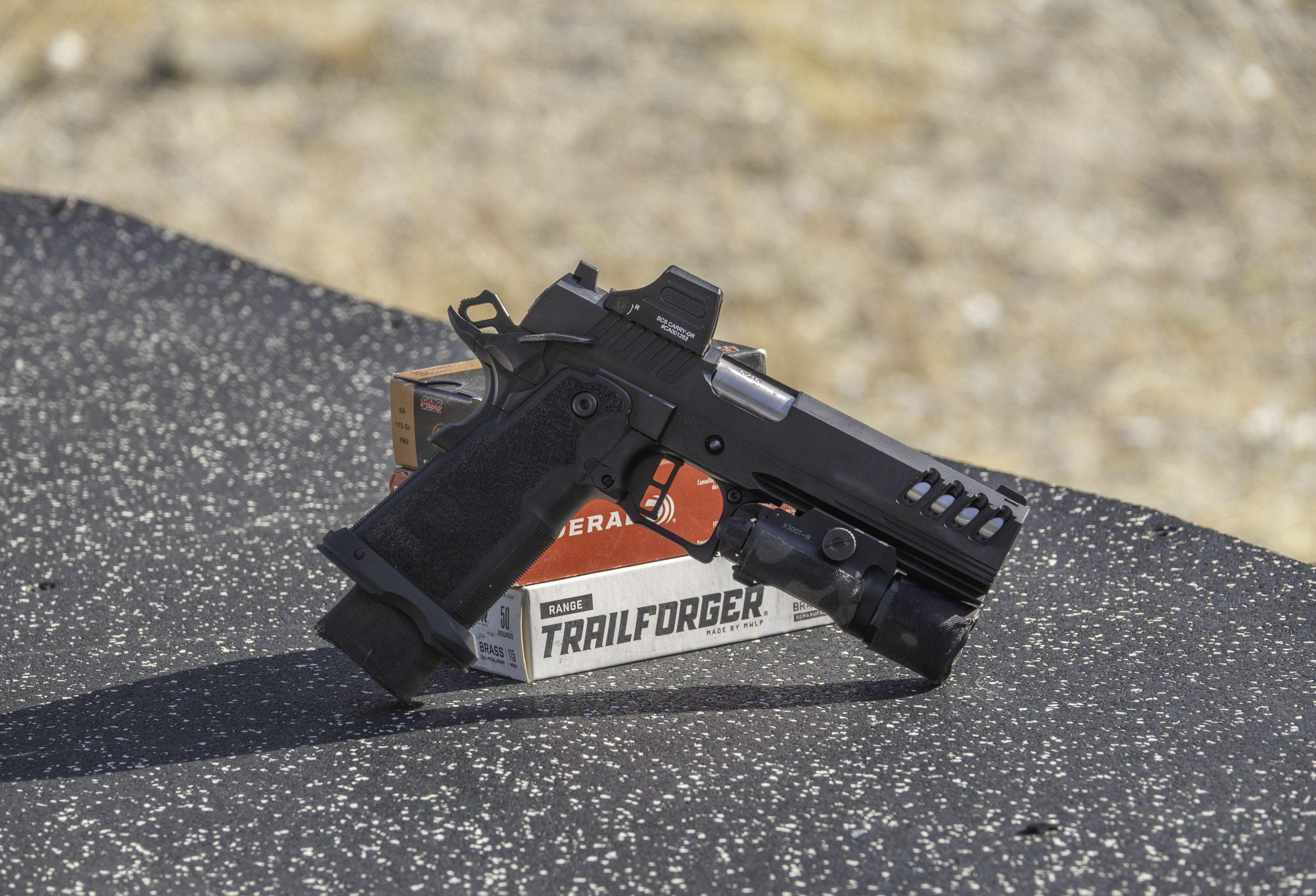 The Bersa M2Xi staged on boxes of Federal and Trailforger 9mm ammunition used throughout the review's range testing.