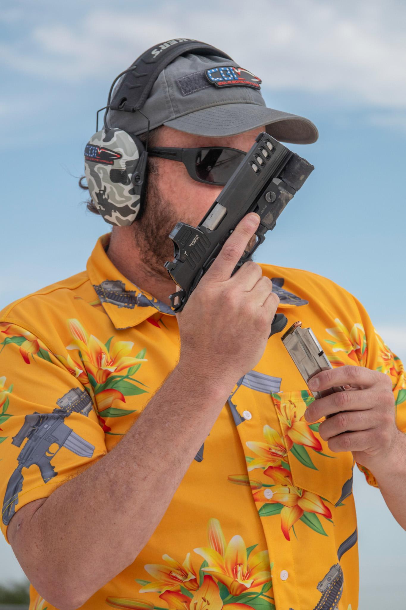 Jeff Wood inserts a fresh mag into the Bersa M2Xi magazine between drills.